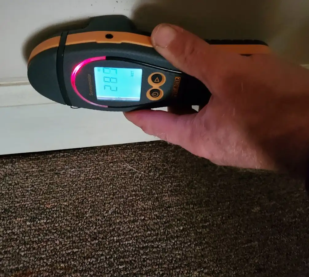 Moisture detection at baseboard during Storm Damage Restoration in Waldwick